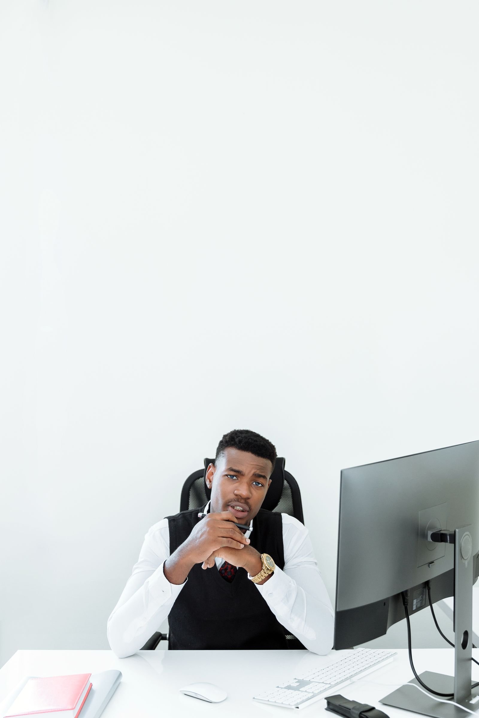 Man working independently at his office desk